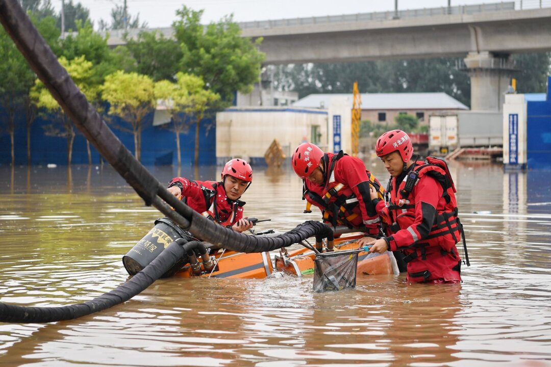 Tote und Vermisste nach heftigen Regenfällen in Südchina - In Südchina haben starke Regenfälle zahlreiche Flüsse anschwellen lassen und für Überschwemmungen gesorgt.
