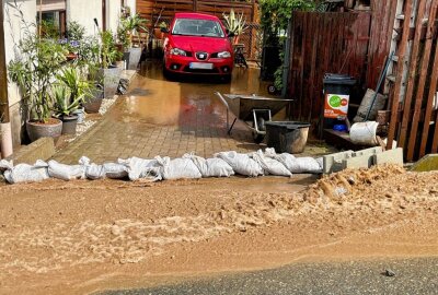 Erneut massive Überschwemmungen in Lauter - Überschwemmungen in Lauter. Schlammmassen geraten in die Grundstücke der Anwohner. Foto: Daniel Unger